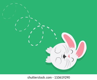 Cartoon round bunny rolling down a grassy hill