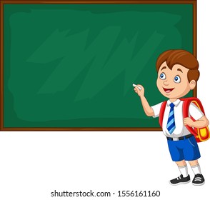 Cartoon school boy in uniform writing on the blackboard