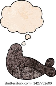 cartoon seal with thought bubble in grunge texture style