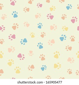 A cartoon seamless pattern of cats dogs footprints