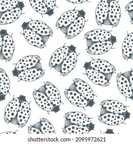 Cartoon seamless pattern with ladybugs.