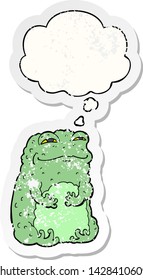 cartoon smug toad with thought bubble as a distressed worn sticker