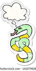 cartoon snake with thought bubble as a distressed worn sticker
