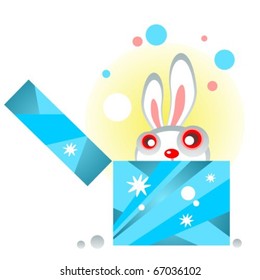 Cartoon snow rabbit with gift on a blue background.