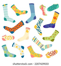 Cartoon socks. Bundle of socks with textures and patterns, clothing elements. Creative set of different woolen and cotton socks with colorful patterns. Flat vector illustration