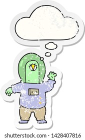 cartoon space alien with thought bubble as a distressed worn sticker