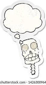 cartoon spooky skull with thought bubble as a distressed worn sticker