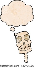 cartoon spooky skull with thought bubble in grunge texture style