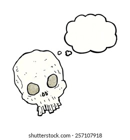 cartoon spooky skull with thought bubble