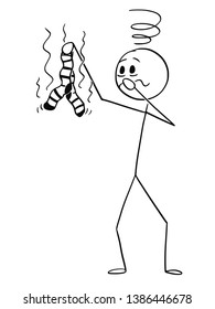 Cartoon stick figure drawing conceptual illustration of man holding stinking, stinky or smelly pair of dirty socks and feels sick because of the smell.