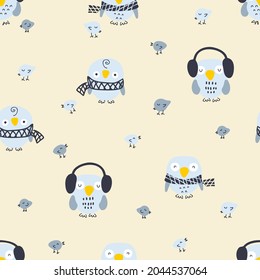 Cartoon style winter seamless pattern with owls and small birds. Perfect for T-shirt, textile and prints. Hand drawn vector illustration for decor and design.

