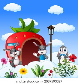 Cartoon three of bunnies in front the strawberry house