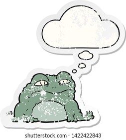 cartoon toad with thought bubble as a distressed worn sticker