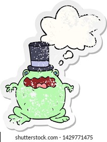 cartoon toad wearing top hat with thought bubble as a distressed worn sticker