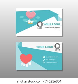 cartoon tooth with business card on the gray background