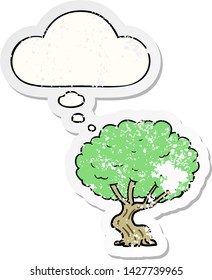 cartoon tree with thought bubble as a distressed worn sticker