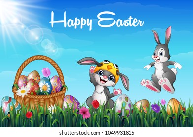 Cartoon two happy bunnies with Easter basket full of decorated Easter eggs in a grass field
