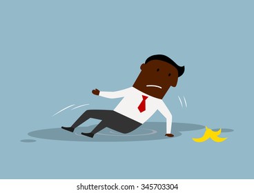 Cartoon upset african american businessman slipped on a banana peel and fell. Accident or business failure concept design