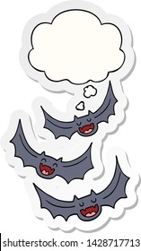 cartoon vampire bats with thought bubble as a printed sticker