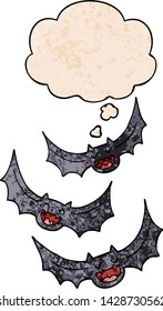 cartoon vampire bats with thought bubble in grunge texture style