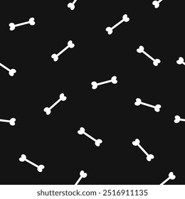 Cartoon vector bones seamless pattern with white bones on black background.