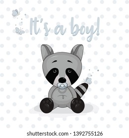 Cartoon vector design invitation card with baby raccoon sitting with a blue pacifier with the text It's a boy and a blue dotted background