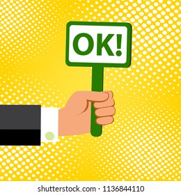 Cartoon vector illustration of  hand holding plate with word OK