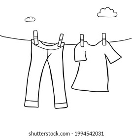 Cartoon vector illustration of hang laundry jeans and t-shirt. Black outlined and white colored.