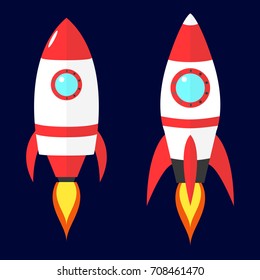 Cartoon vector red rockets on dark blue background. Flat spaceship.