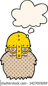 cartoon viking face with thought bubble in comic book style