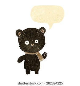 cartoon waving black bear with speech bubble
