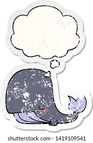 cartoon whale with thought bubble as a distressed worn sticker