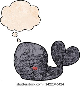 cartoon whale with thought bubble in grunge texture style