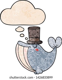 cartoon whale with top hat with thought bubble in grunge texture style