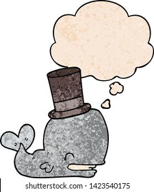 cartoon whale wearing top hat with thought bubble in grunge texture style
