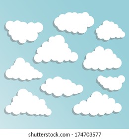 Cartoon white clouds on blue sky for design. Set of clouds with shadow.