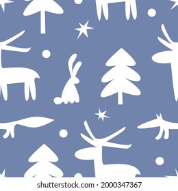 Cartoon white silhouettes of animals, trees and stars on a blue background. Seamless pattern. Winter illustration. Vector. 