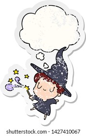 cartoon witch with thought bubble as a distressed worn sticker