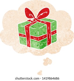 regalo envuelto en dibujos animados con burbuja de pensamiento en un estilo retro angustiado