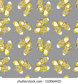 Cartoon yellow sneakers background. Vector seamless pattern.