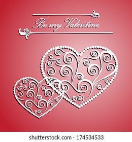 Carved paper heart with a pattern of curlicues to St. Valentine's day and weddings