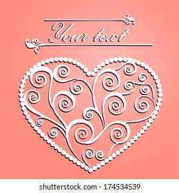 Carved paper heart with a pattern of curlicues to St. Valentine's day and weddings