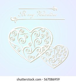 Carved paper heart with a pattern of curlicues to St. Valentine's day and weddings