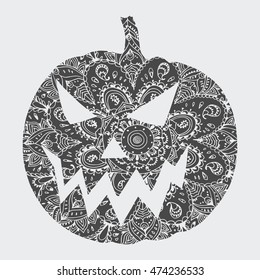 Carved pumpkin for Halloween. Scary pumpkin. An evil pumpkin. Silhouette.