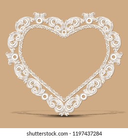 carved vintage frame made of paper for picture or photo with shadow on light background