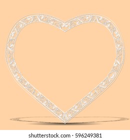 carved vintage frame made of paper for picture or photo with shadow on light background