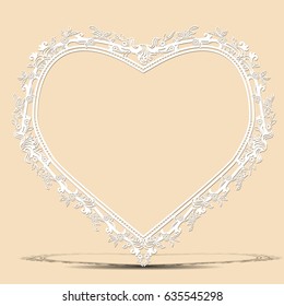carved vintage frame made of paper for picture or photo with shadow on light background