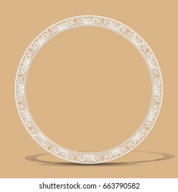 carved vintage frame made of paper for picture or photo with shadow on gray background