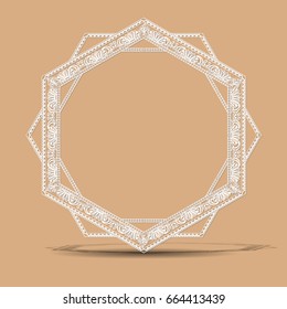 carved vintage frame made of paper for picture or photo with shadow on light background