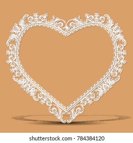 carved vintage frame made of paper for picture or photo with shadow on light background